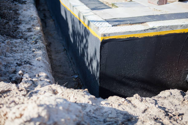 Professional Basement Waterproofing technician working in Talladega, AL